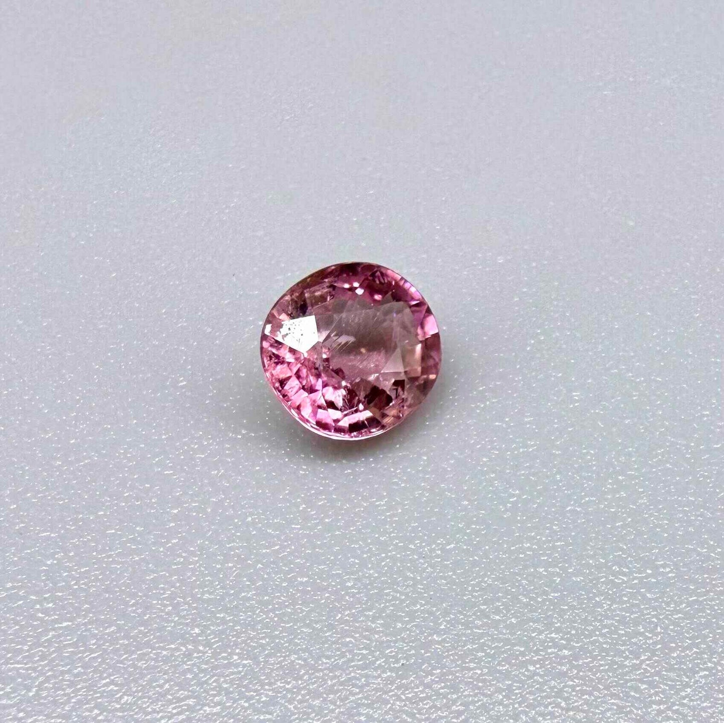 Natural untreated rich pink tourmaline, 0.73 ct round cut from Nigeria with rich pink colour, eye-clean clarity and lively brilliance