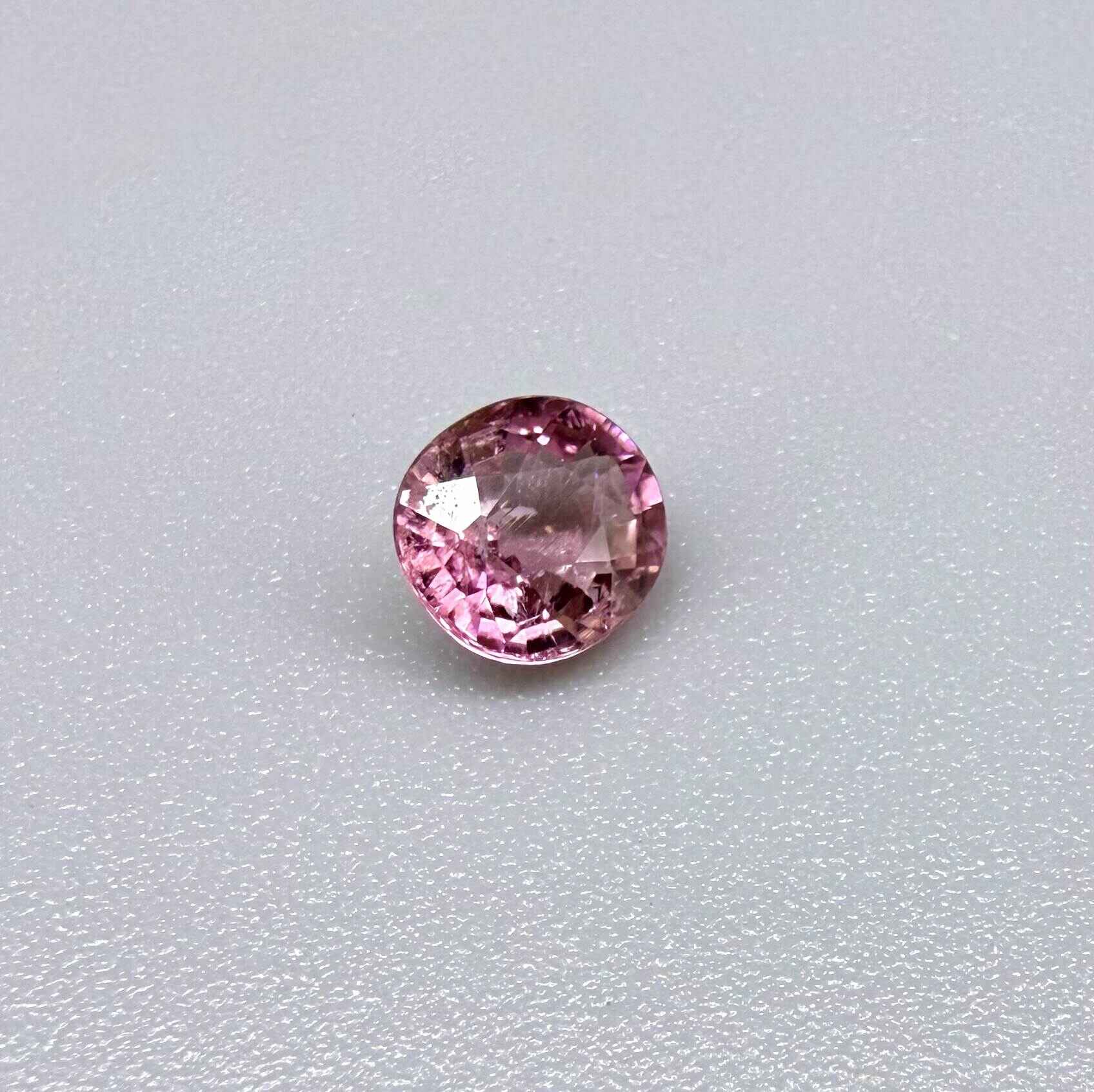 Natural untreated rich pink tourmaline, 0.73 ct round cut from Nigeria with rich pink colour, eye-clean clarity and lively brilliance