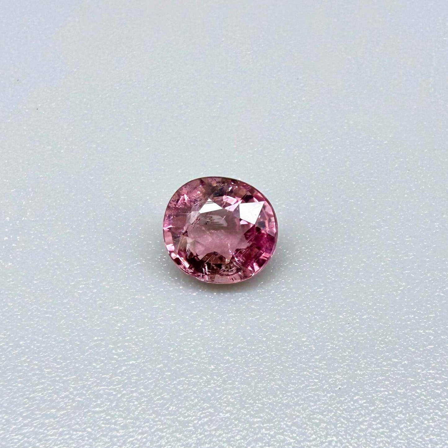 Natural untreated rich pink tourmaline, 0.73 ct round cut from Nigeria with rich pink colour, eye-clean clarity and lively brilliance