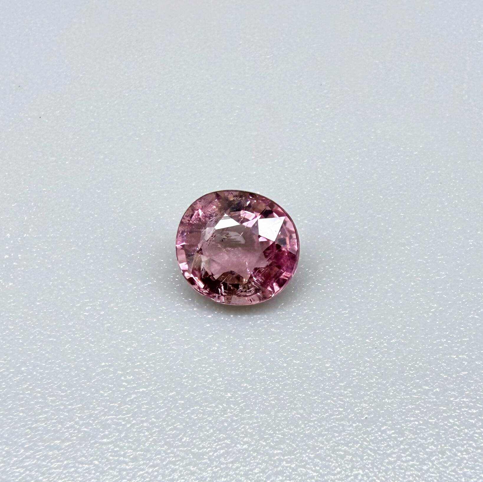 Natural untreated rich pink tourmaline, 0.73 ct round cut from Nigeria with rich pink colour, eye-clean clarity and lively brilliance