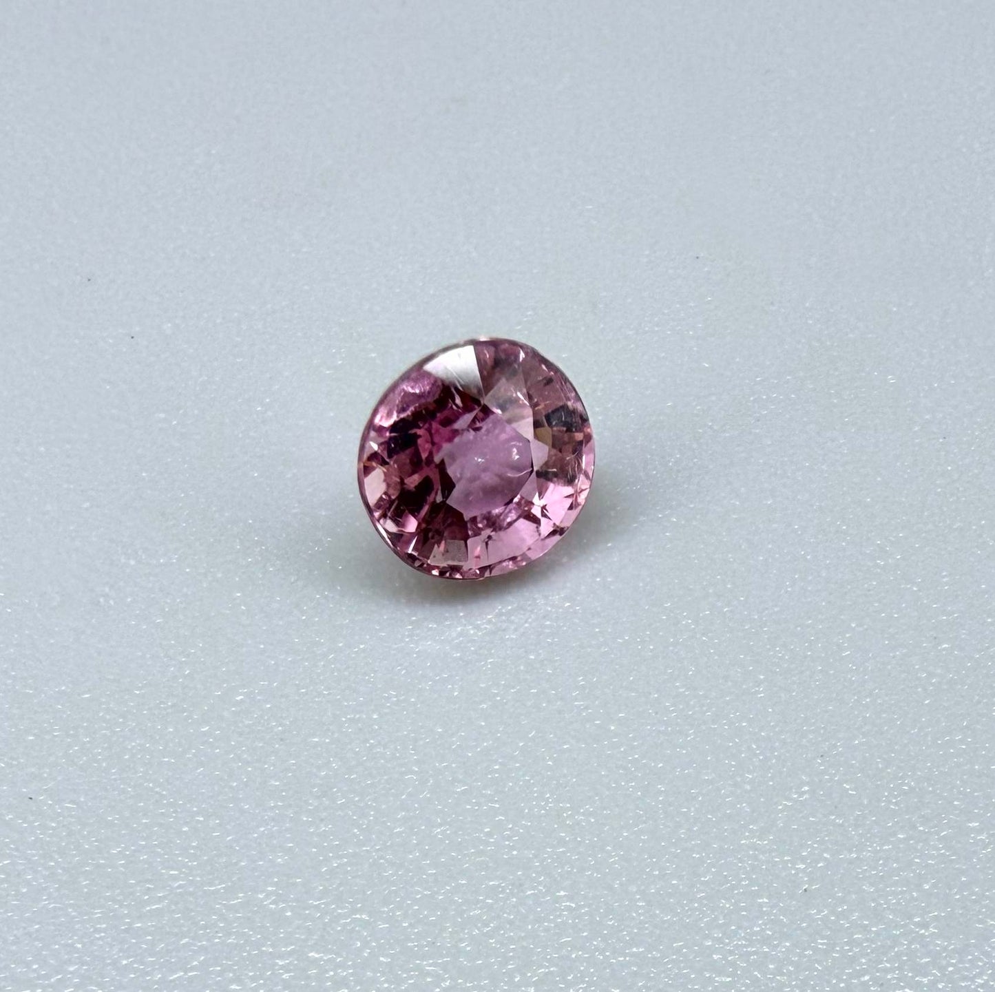 Natural untreated rich pink tourmaline, 0.89 ct oval cut from Nigeria with rich pink colour, eye-clean clarity and excellent brilliance.