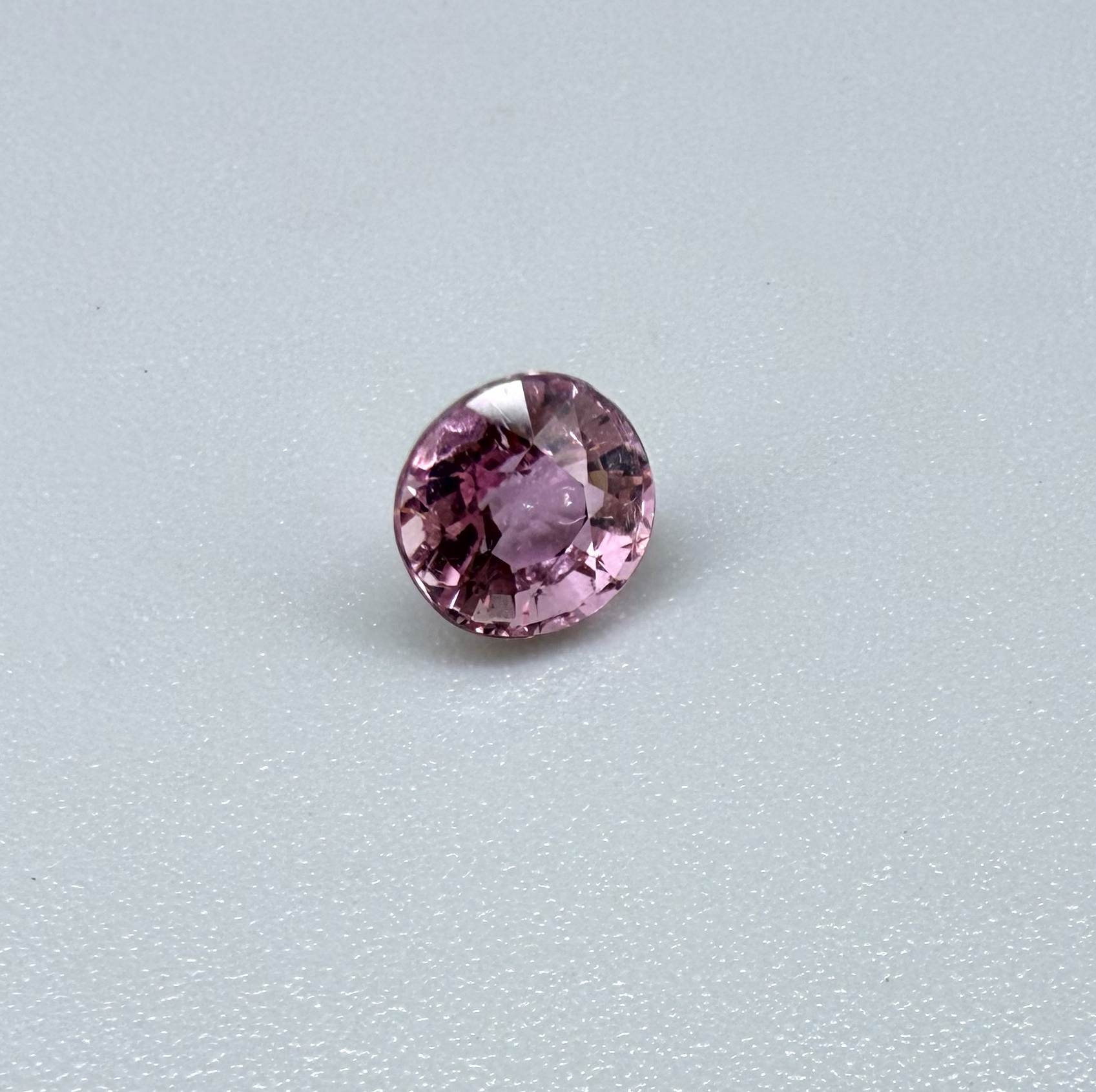 Natural untreated rich pink tourmaline, 0.89 ct oval cut from Nigeria with rich pink colour, eye-clean clarity and excellent brilliance.