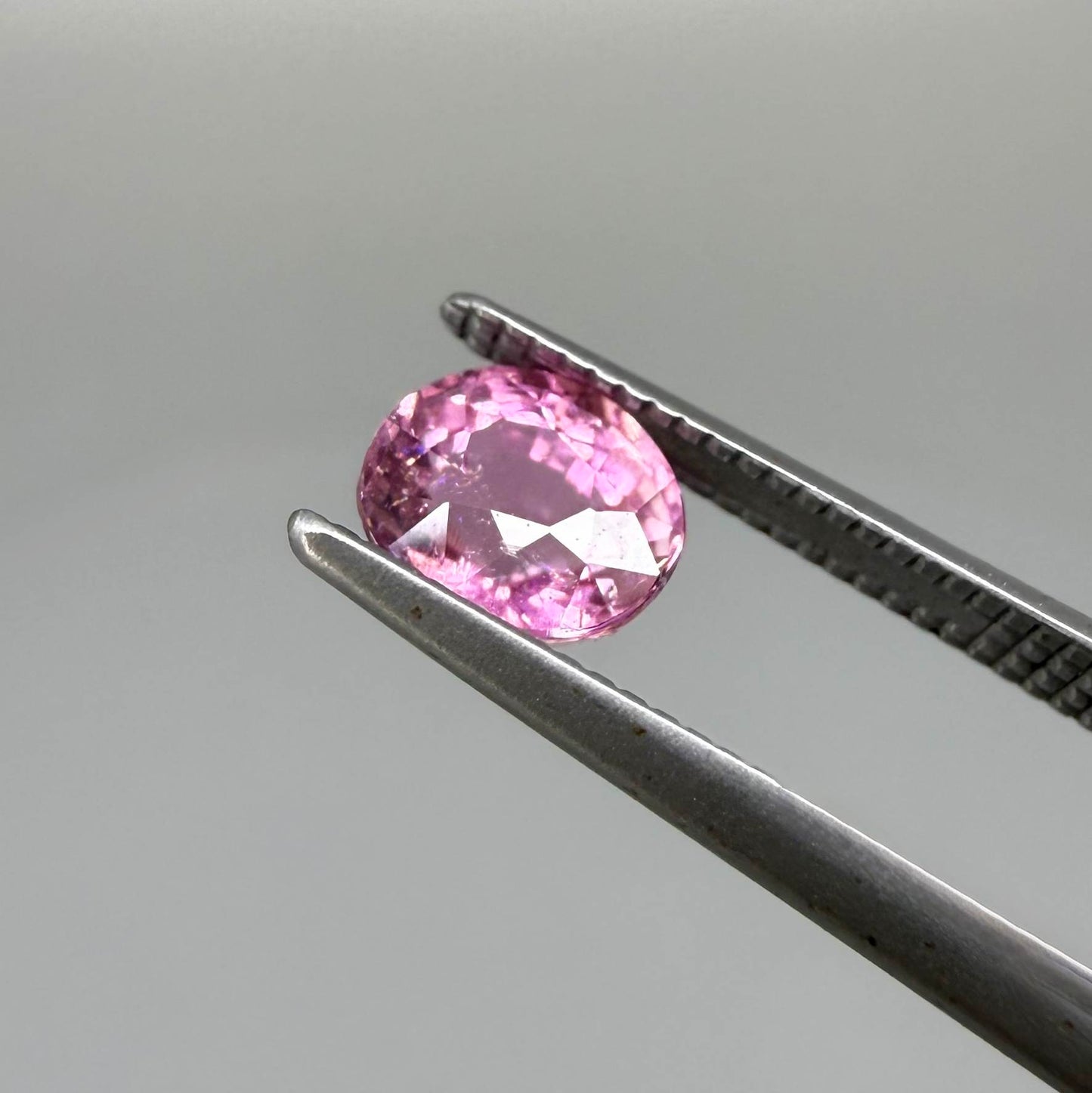 Natural untreated rich pink tourmaline, 0.89 ct oval cut from Nigeria with rich pink colour, eye-clean clarity and excellent brilliance.