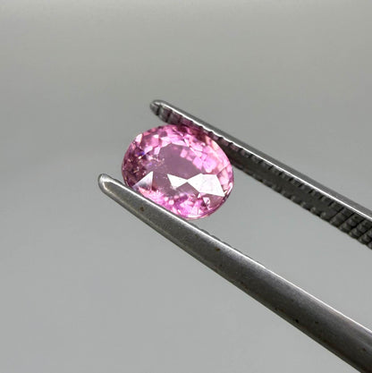 Natural untreated rich pink tourmaline, 0.89 ct oval cut from Nigeria with rich pink colour, eye-clean clarity and excellent brilliance.