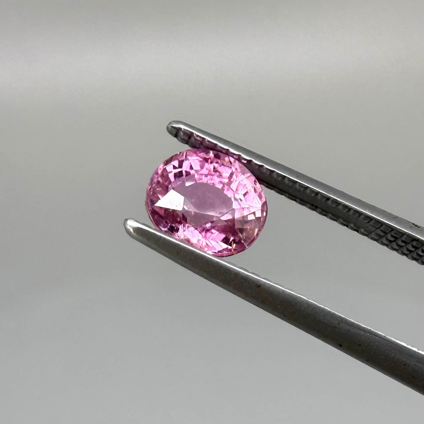 Natural untreated rich pink tourmaline, 0.89 ct oval cut from Nigeria with rich pink colour, eye-clean clarity and excellent brilliance.