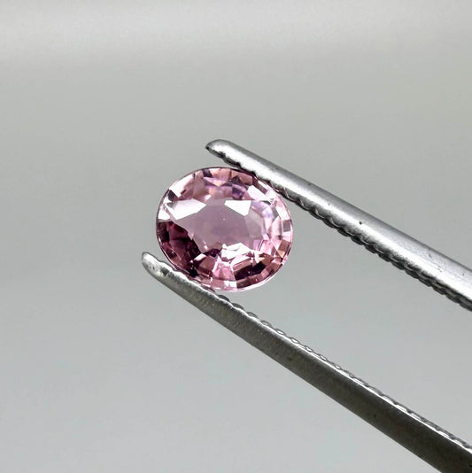 Natural untreated pink tourmaline, 0.31 ct round cut from Nigeria with soft pink colour and lively brilliance.