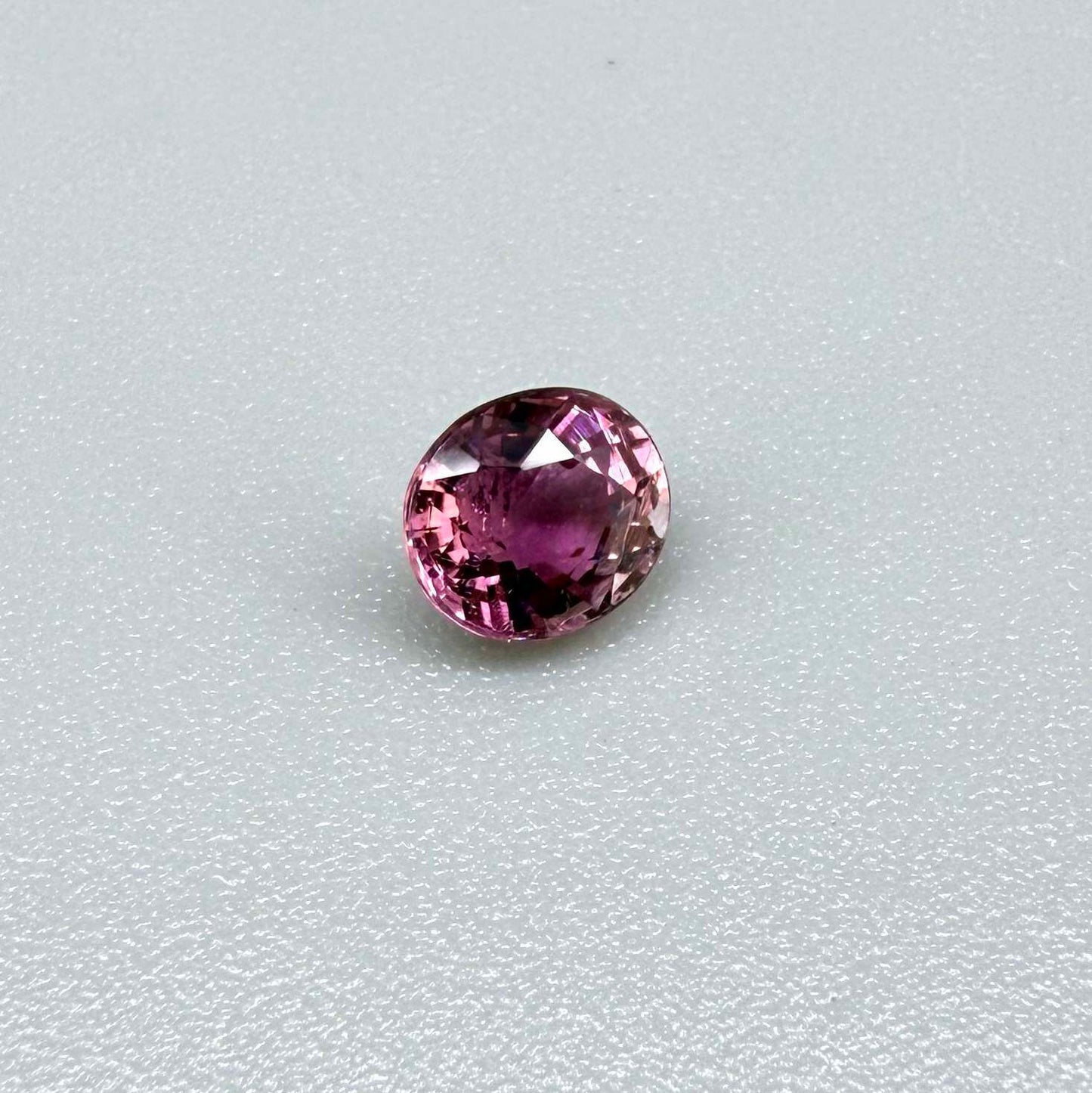 Natural untreated vivid magenta pink tourmaline, 0.66 ct oval cut from Nigeria with exceptional magenta pink colour, eye-clean clarity and outstanding brilliance.