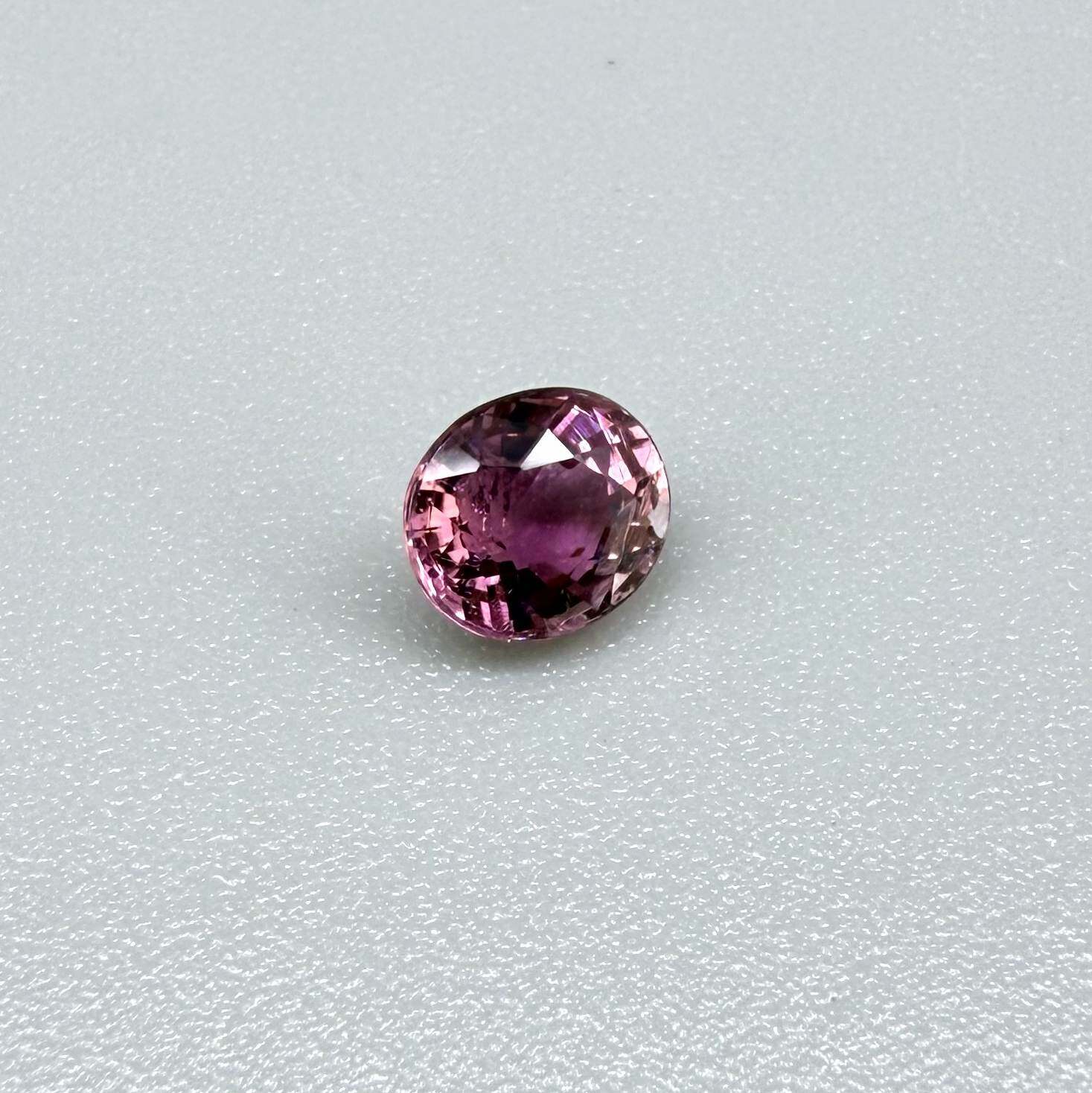 Natural untreated vivid magenta pink tourmaline, 0.66 ct oval cut from Nigeria with exceptional magenta pink colour, eye-clean clarity and outstanding brilliance.