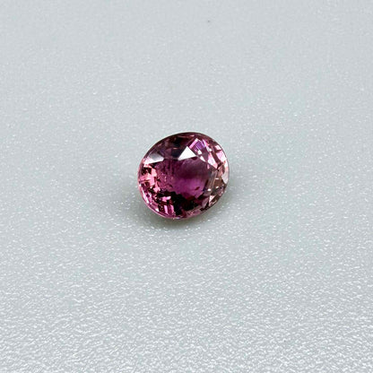 Natural untreated vivid magenta pink tourmaline, 0.66 ct oval cut from Nigeria with exceptional magenta pink colour, eye-clean clarity and outstanding brilliance.