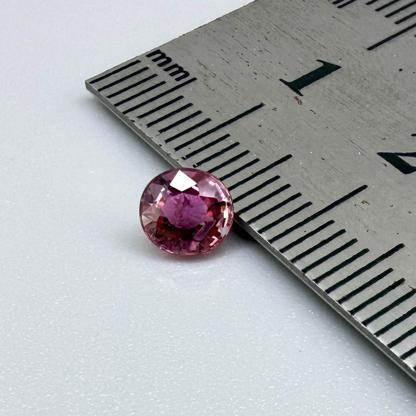 Natural untreated vivid magenta pink tourmaline, 0.66 ct oval cut from Nigeria with exceptional magenta pink colour, eye-clean clarity and outstanding brilliance.