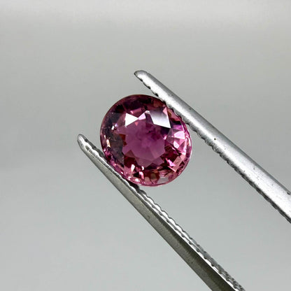 Natural untreated vivid magenta pink tourmaline, 0.66 ct oval cut from Nigeria with exceptional magenta pink colour, eye-clean clarity and outstanding brilliance.