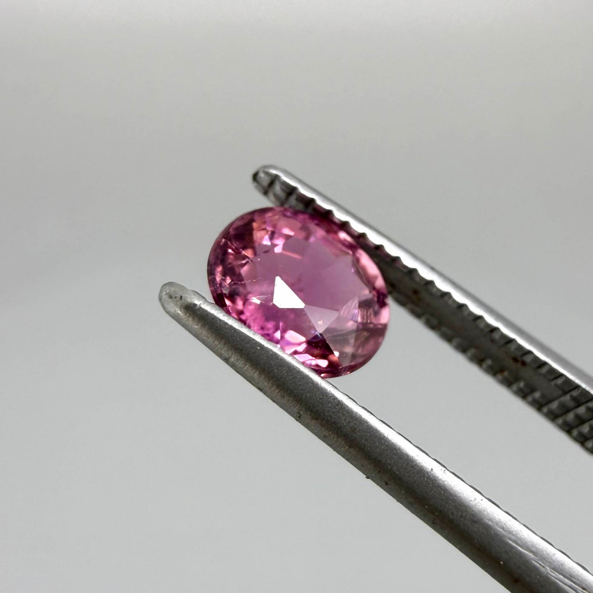 Natural untreated vivid magenta pink tourmaline, 0.66 ct oval cut from Nigeria with exceptional magenta pink colour, eye-clean clarity and outstanding brilliance.