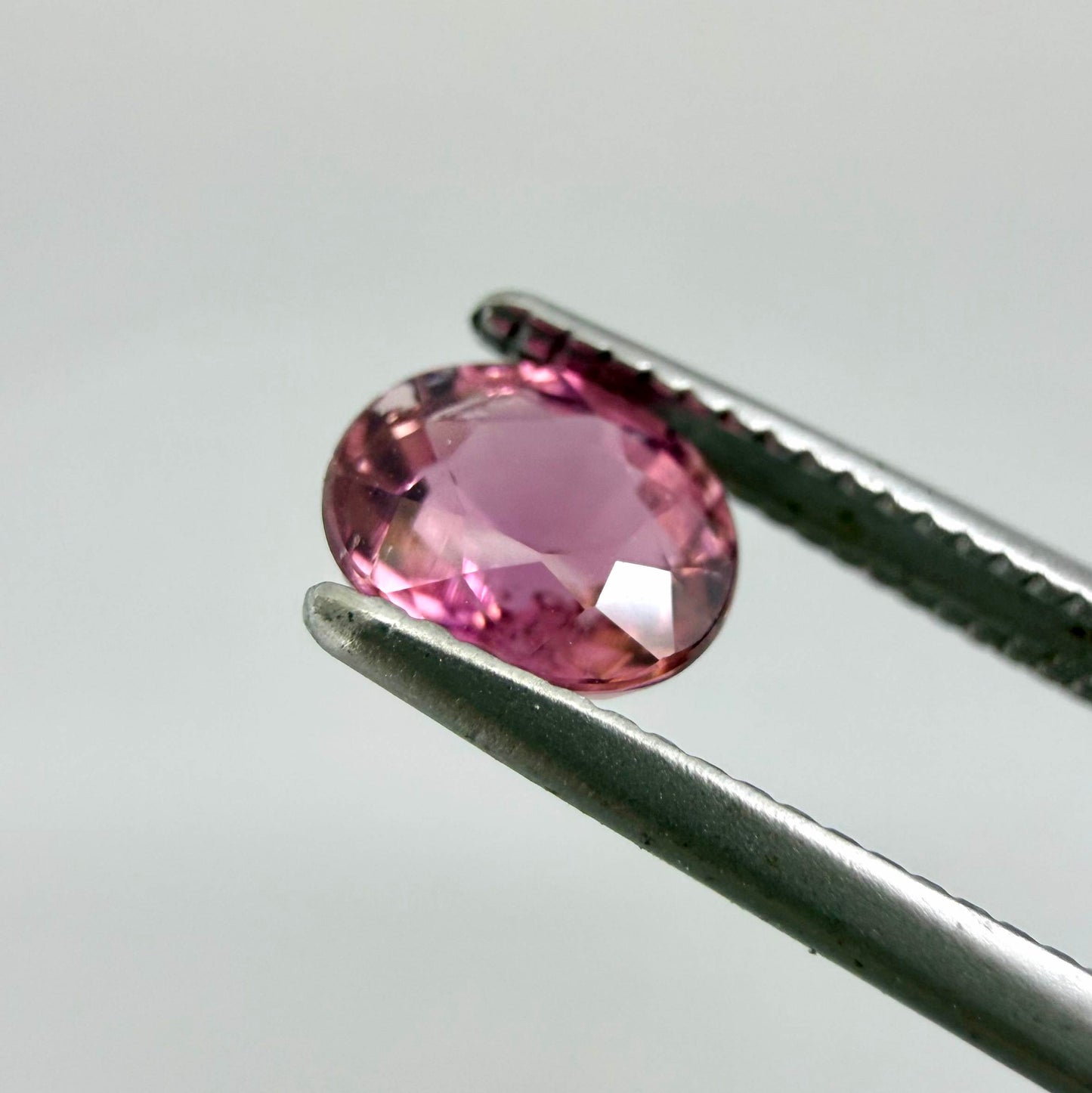 Natural untreated vivid magenta pink tourmaline, 0.66 ct oval cut from Nigeria with exceptional magenta pink colour, eye-clean clarity and outstanding brilliance.