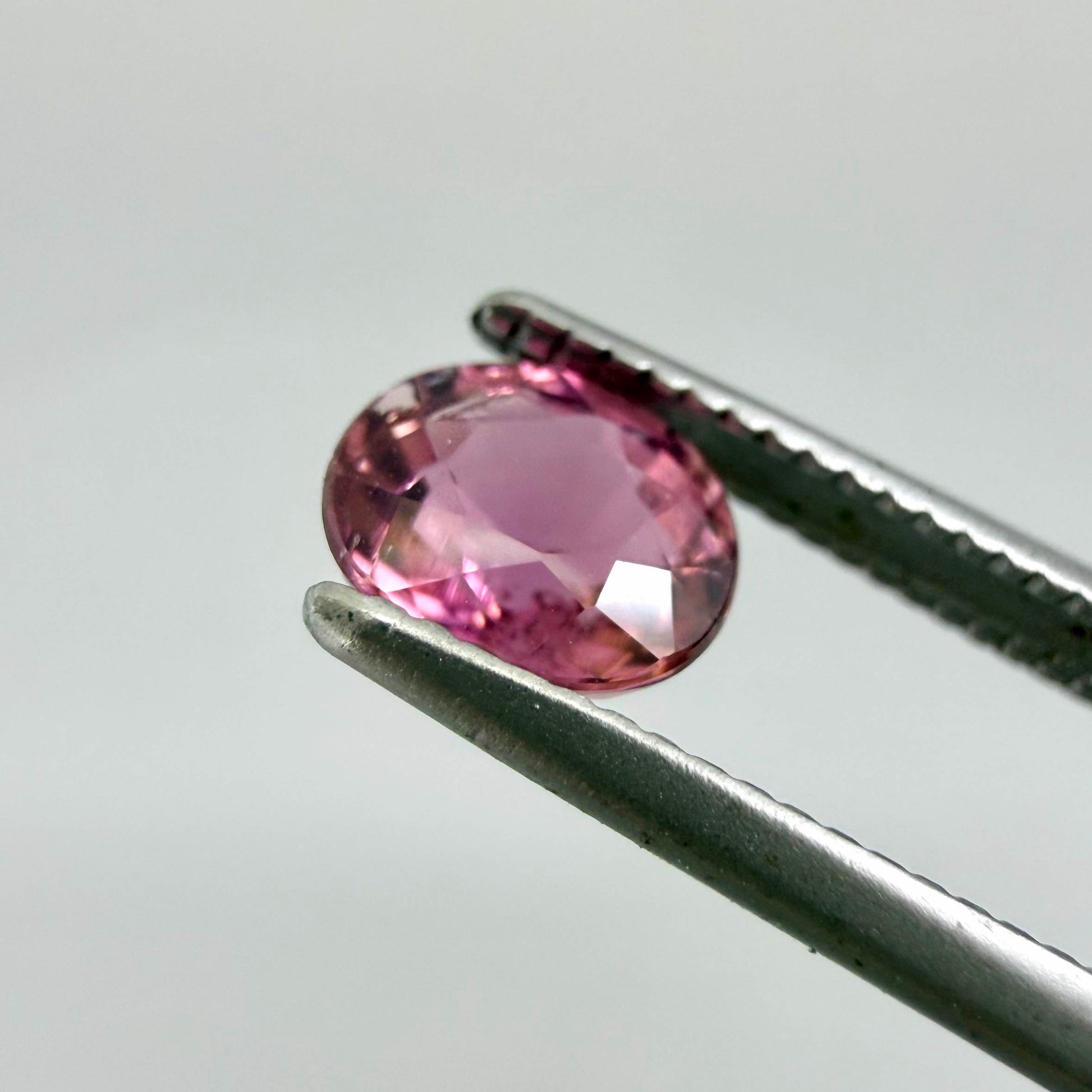 Natural untreated vivid magenta pink tourmaline, 0.66 ct oval cut from Nigeria with exceptional magenta pink colour, eye-clean clarity and outstanding brilliance.