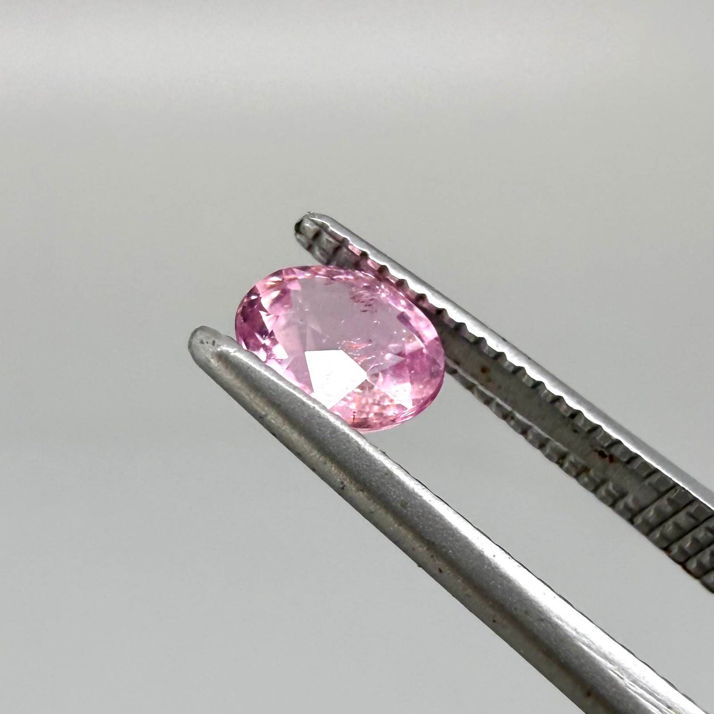 Natural untreated pink tourmaline, 0.52 ct oval cut from Nigeria with soft pink colour, eye-clean clarity and excellent brilliance.