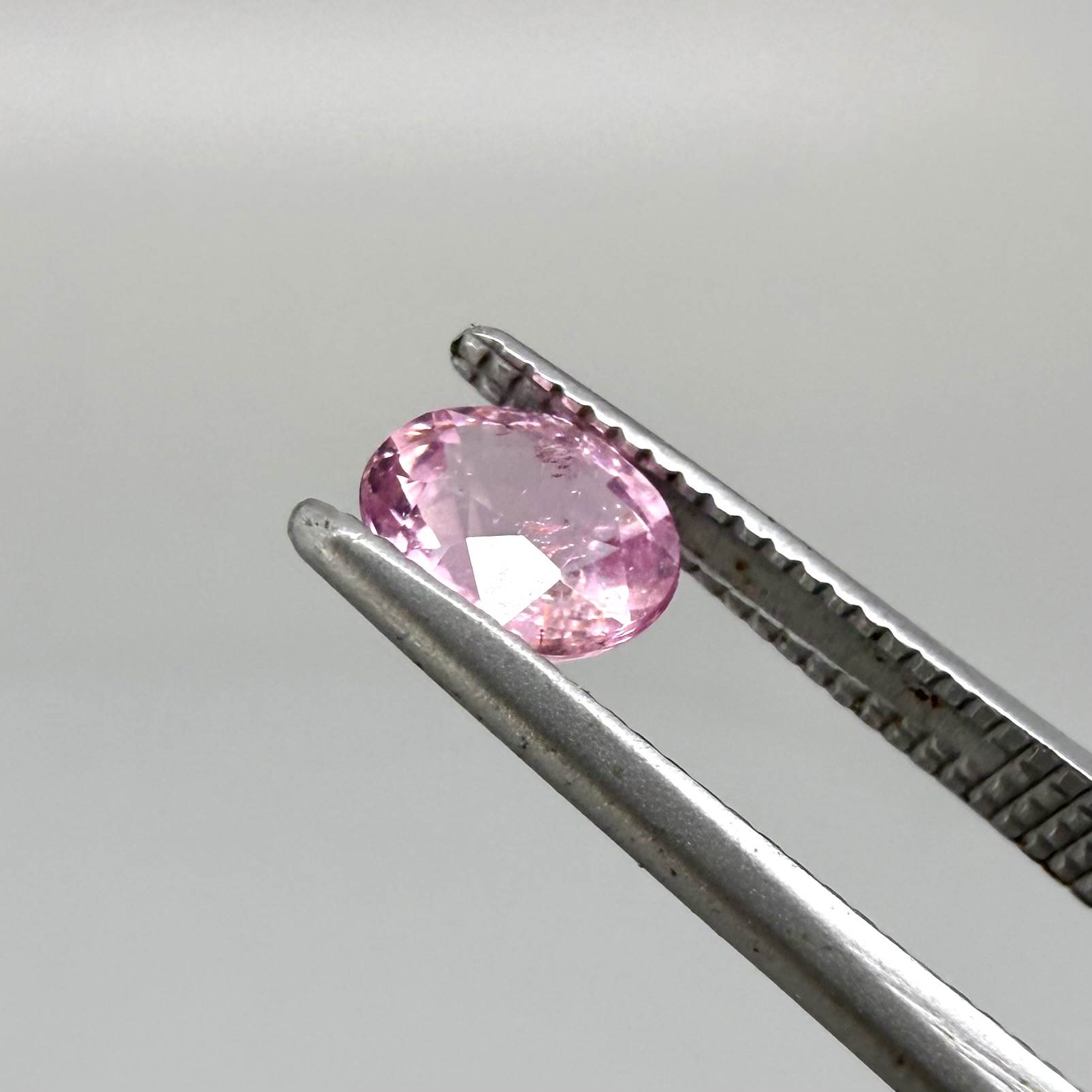 Natural untreated pink tourmaline, 0.52 ct oval cut from Nigeria with soft pink colour, eye-clean clarity and excellent brilliance.