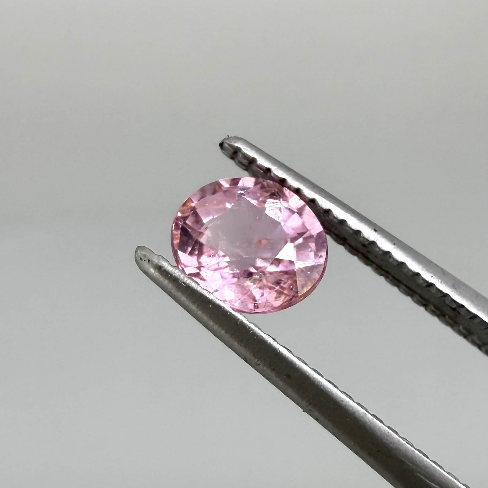 Natural untreated pink tourmaline, 0.52 ct oval cut from Nigeria with soft pink colour, eye-clean clarity and excellent brilliance.