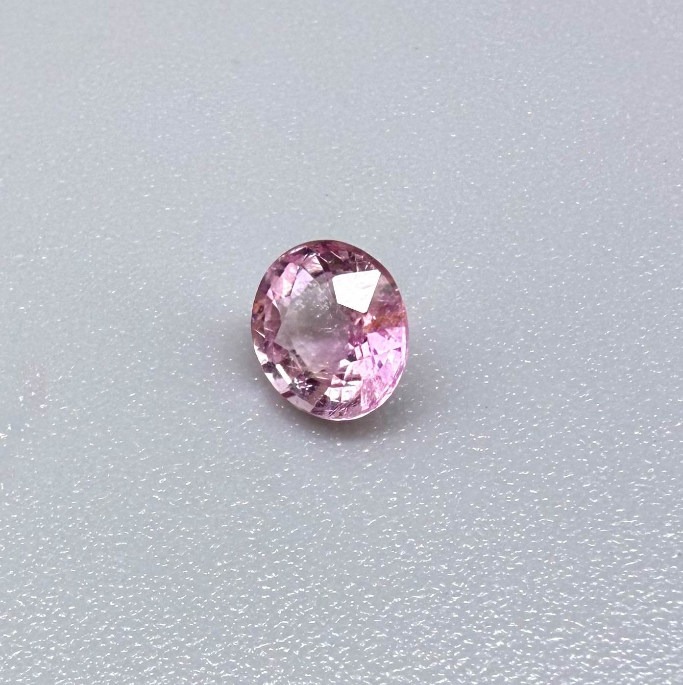 Natural untreated pink tourmaline, 0.52 ct oval cut from Nigeria with soft pink colour, eye-clean clarity and excellent brilliance.