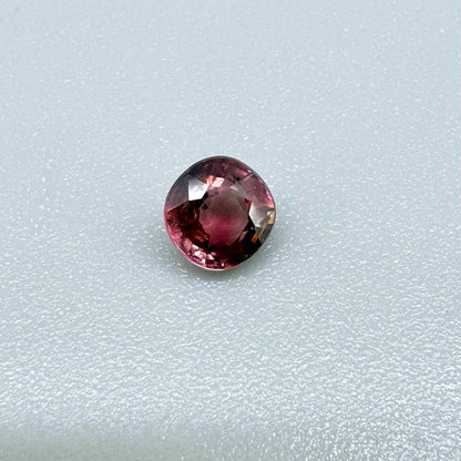 Natural untreated cherry pink tourmaline, 0.52 ct cushion cut from Nigeria with rich cherry pink colour, eye-clean clarity and excellent brilliance.