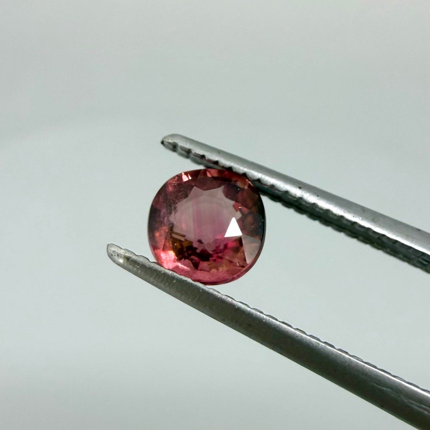 Natural untreated cherry pink tourmaline, 0.52 ct cushion cut from Nigeria with rich cherry pink colour, eye-clean clarity and excellent brilliance.