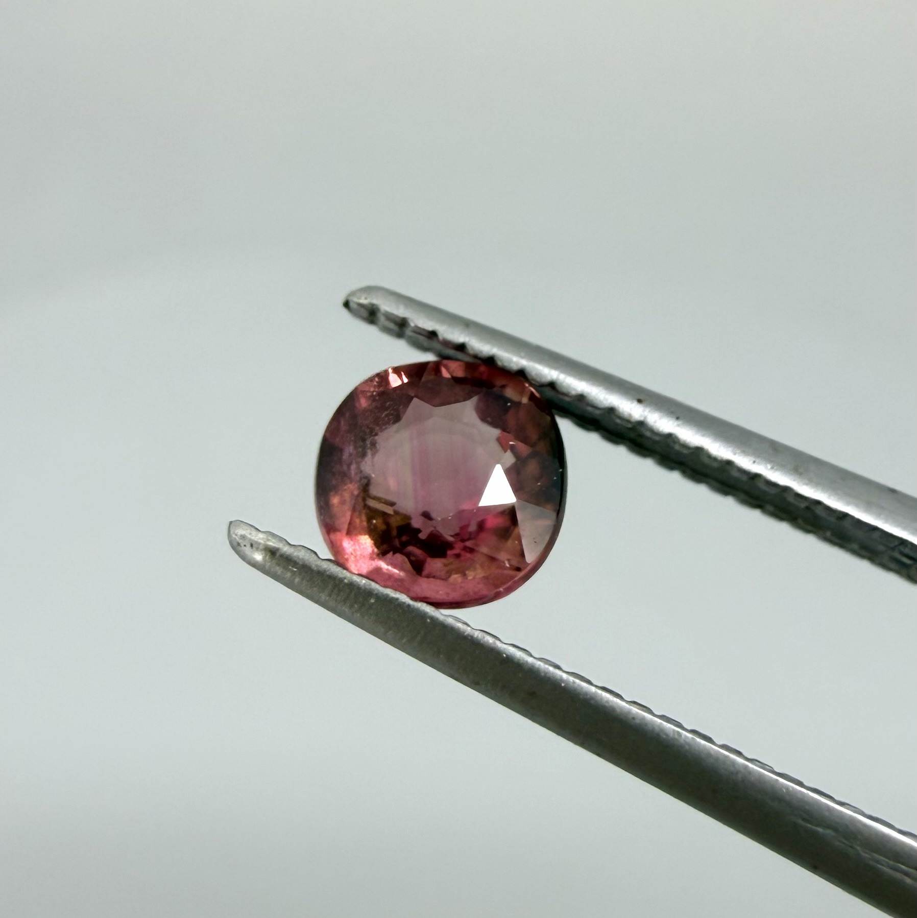 Natural untreated cherry pink tourmaline, 0.52 ct cushion cut from Nigeria with rich cherry pink colour, eye-clean clarity and excellent brilliance.