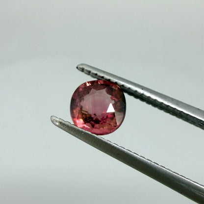 Natural untreated cherry pink tourmaline, 0.52 ct cushion cut from Nigeria with rich cherry pink colour, eye-clean clarity and excellent brilliance.