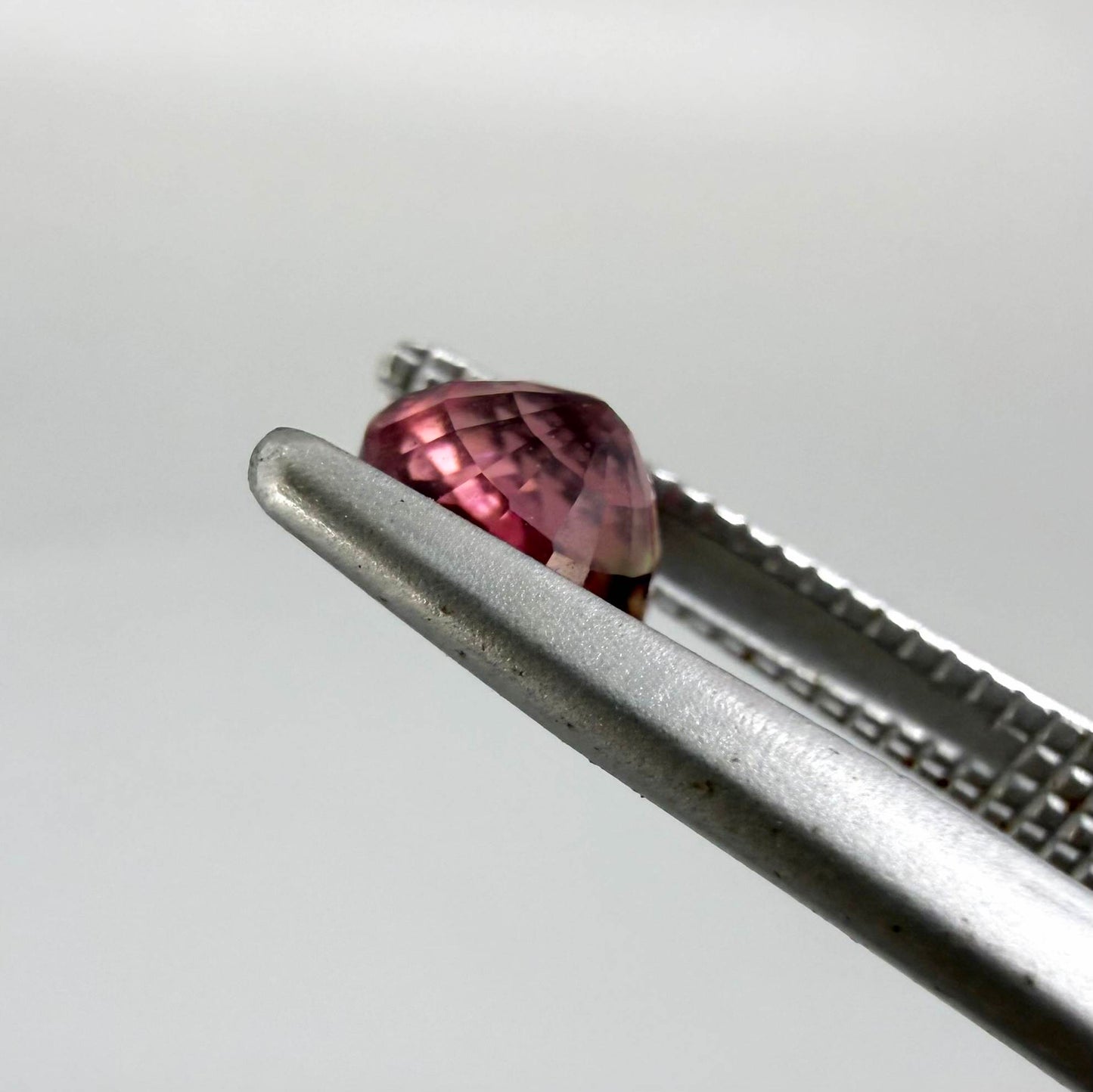 Natural untreated cherry pink tourmaline, 0.52 ct cushion cut from Nigeria with rich cherry pink colour, eye-clean clarity and excellent brilliance.