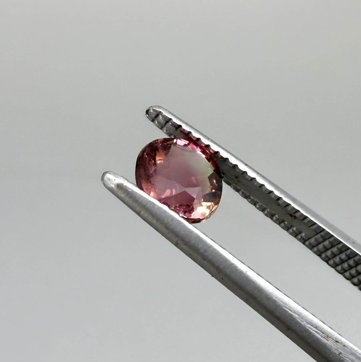 Natural untreated cherry pink tourmaline, 0.52 ct cushion cut from Nigeria with rich cherry pink colour, eye-clean clarity and excellent brilliance.