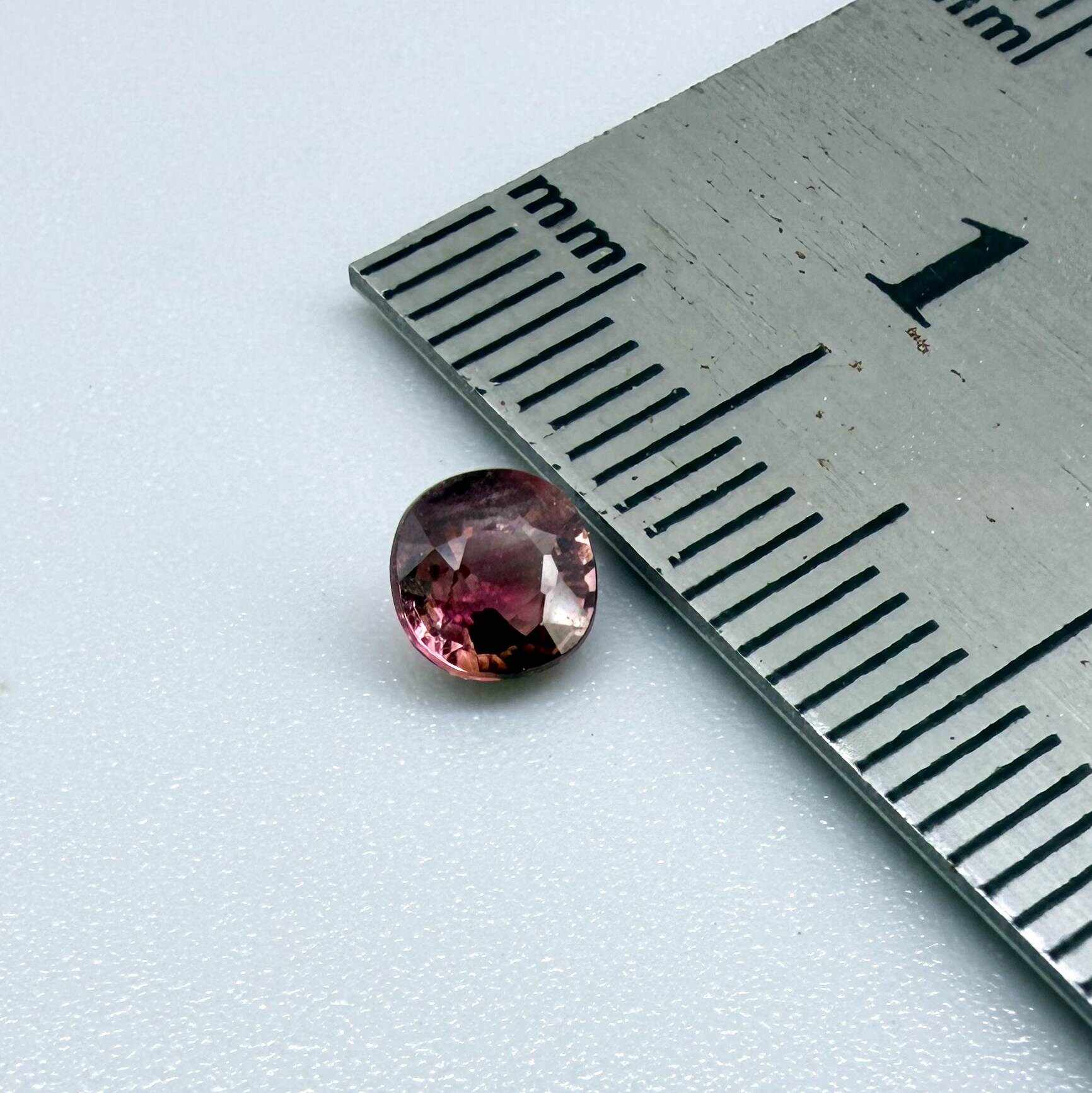 Natural untreated cherry pink tourmaline, 0.52 ct cushion cut from Nigeria with rich cherry pink colour, eye-clean clarity and excellent brilliance.