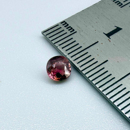 Natural untreated cherry pink tourmaline, 0.52 ct cushion cut from Nigeria with rich cherry pink colour, eye-clean clarity and excellent brilliance.