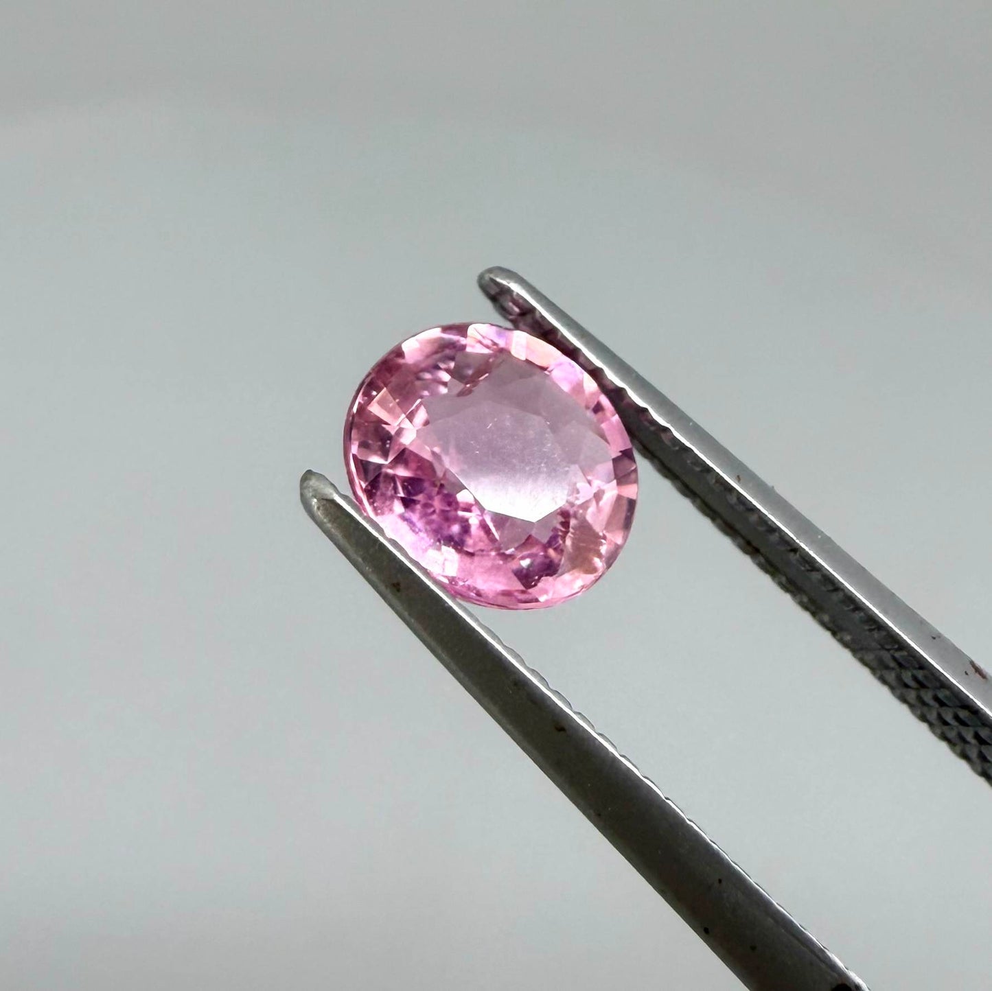 Natural untreated rich pink tourmaline, 0.76 ct oval cut from Nigeria with rich pink colour, lively brilliance and slight natural inclusions.