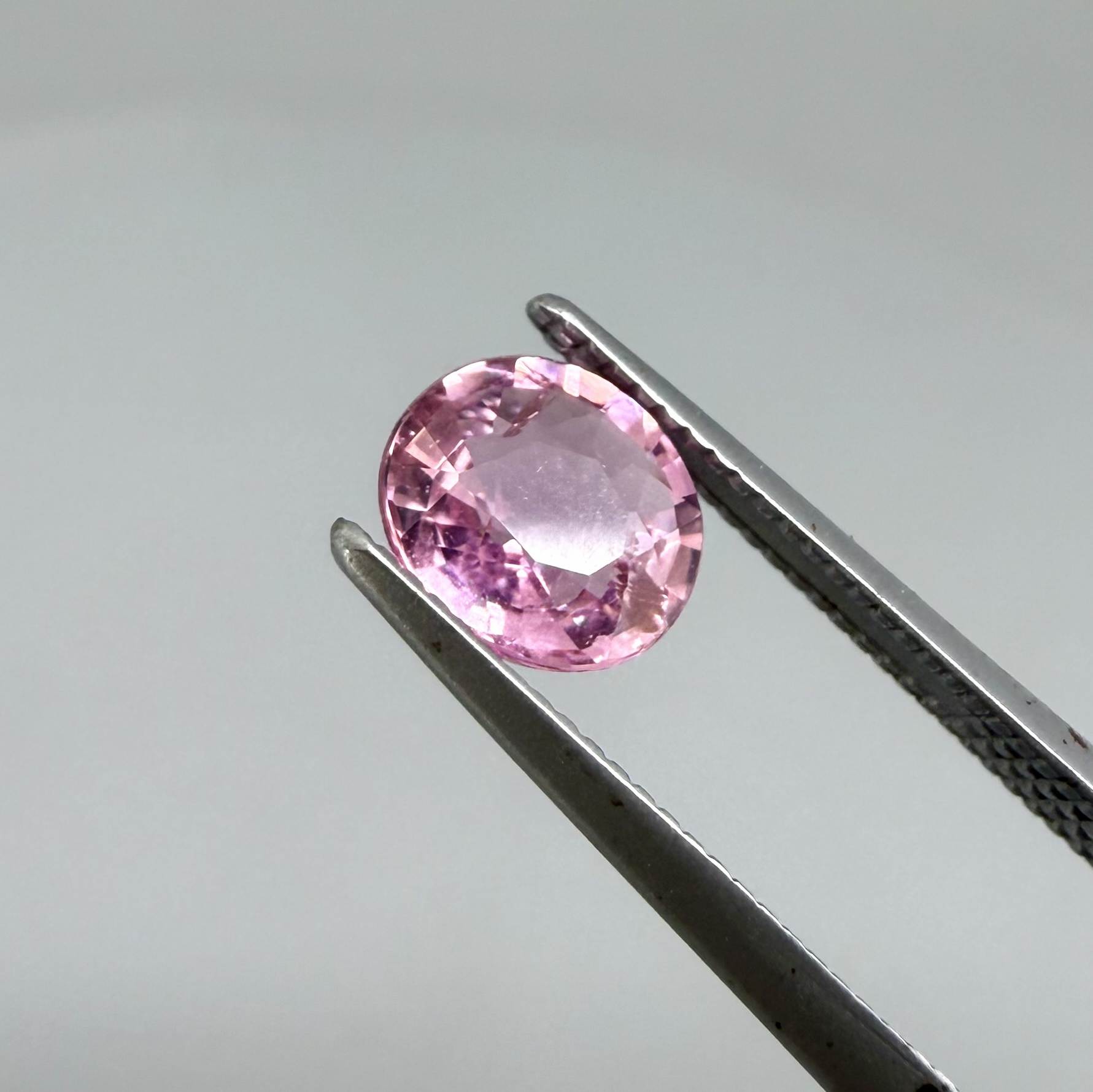 Natural untreated rich pink tourmaline, 0.76 ct oval cut from Nigeria with rich pink colour, lively brilliance and slight natural inclusions.