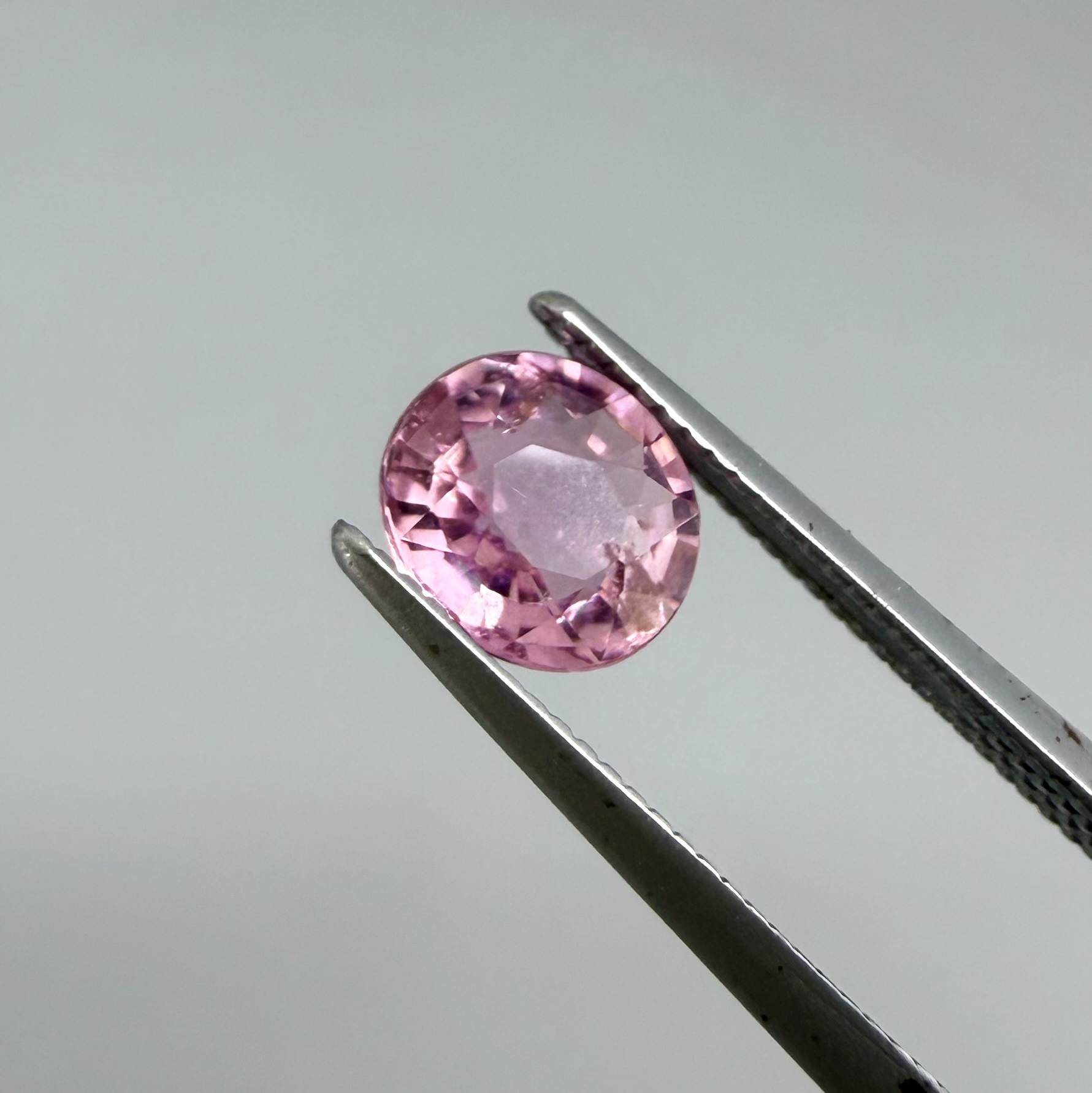 Natural untreated rich pink tourmaline, 0.76 ct oval cut from Nigeria with rich pink colour, lively brilliance and slight natural inclusions.