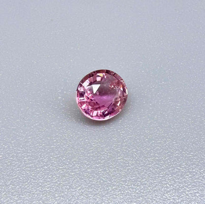 Natural untreated rich pink tourmaline, 0.76 ct oval cut from Nigeria with rich pink colour, lively brilliance and slight natural inclusions.
