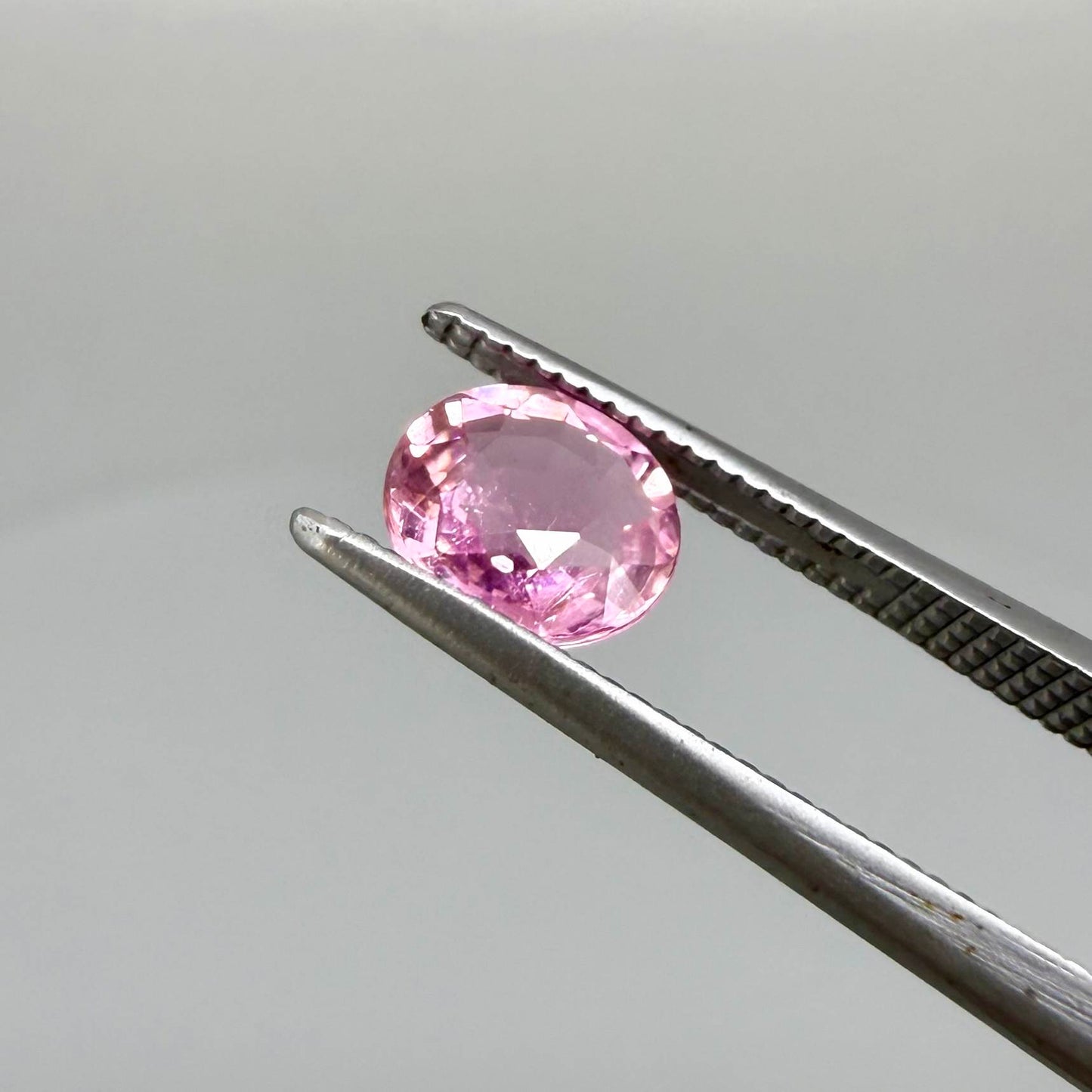 Natural untreated rich pink tourmaline, 0.76 ct oval cut from Nigeria with rich pink colour, lively brilliance and slight natural inclusions.