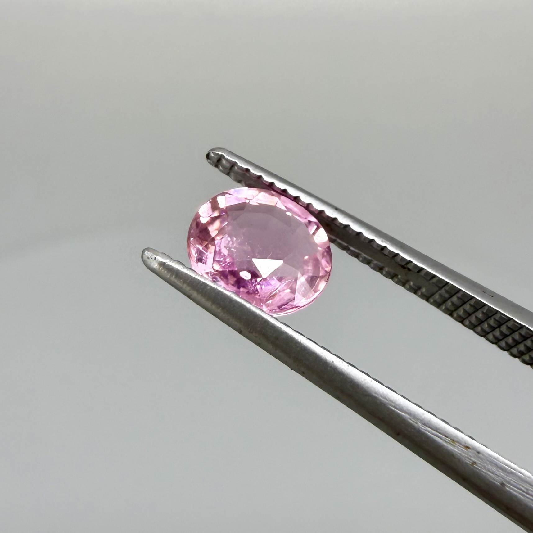 Natural untreated rich pink tourmaline, 0.76 ct oval cut from Nigeria with rich pink colour, lively brilliance and slight natural inclusions.