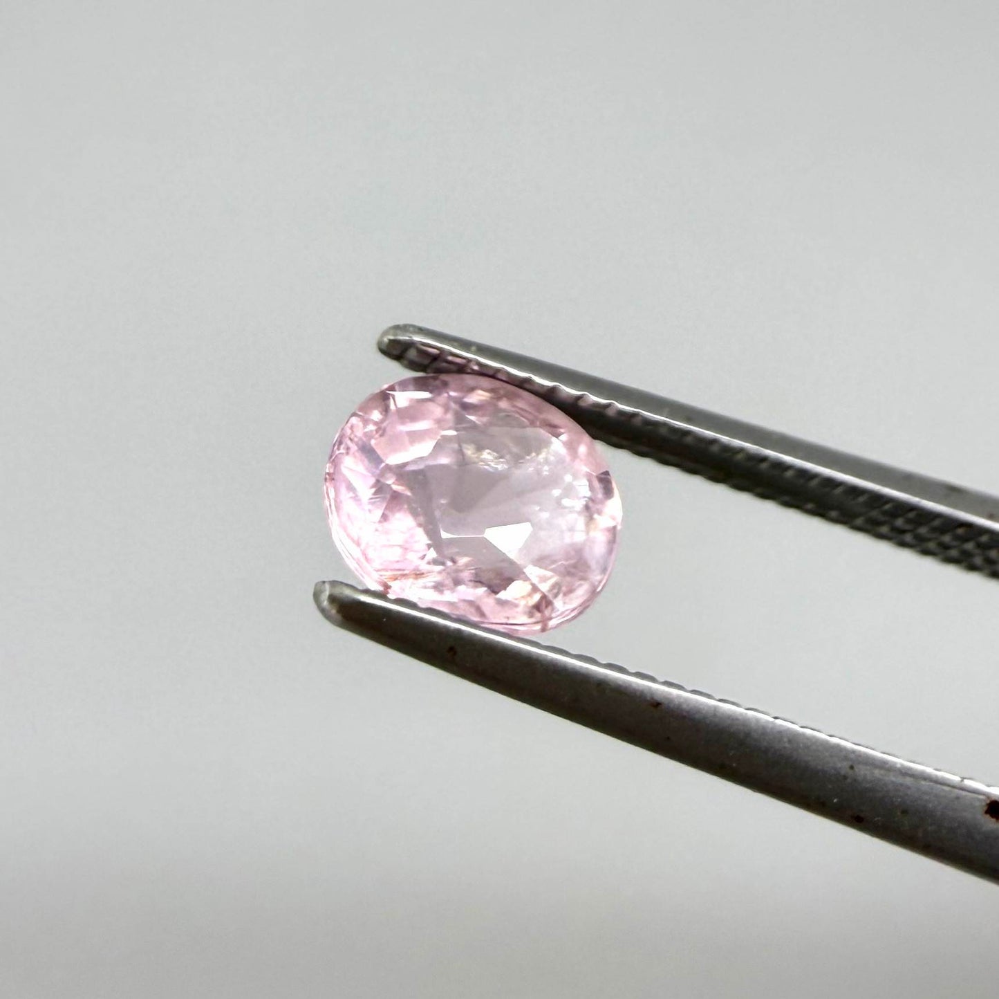 Natural untreated pink tourmaline, 0.75 ct oval cut from Nigeria with soft pink colour, eye-clean clarity and excellent brilliance.