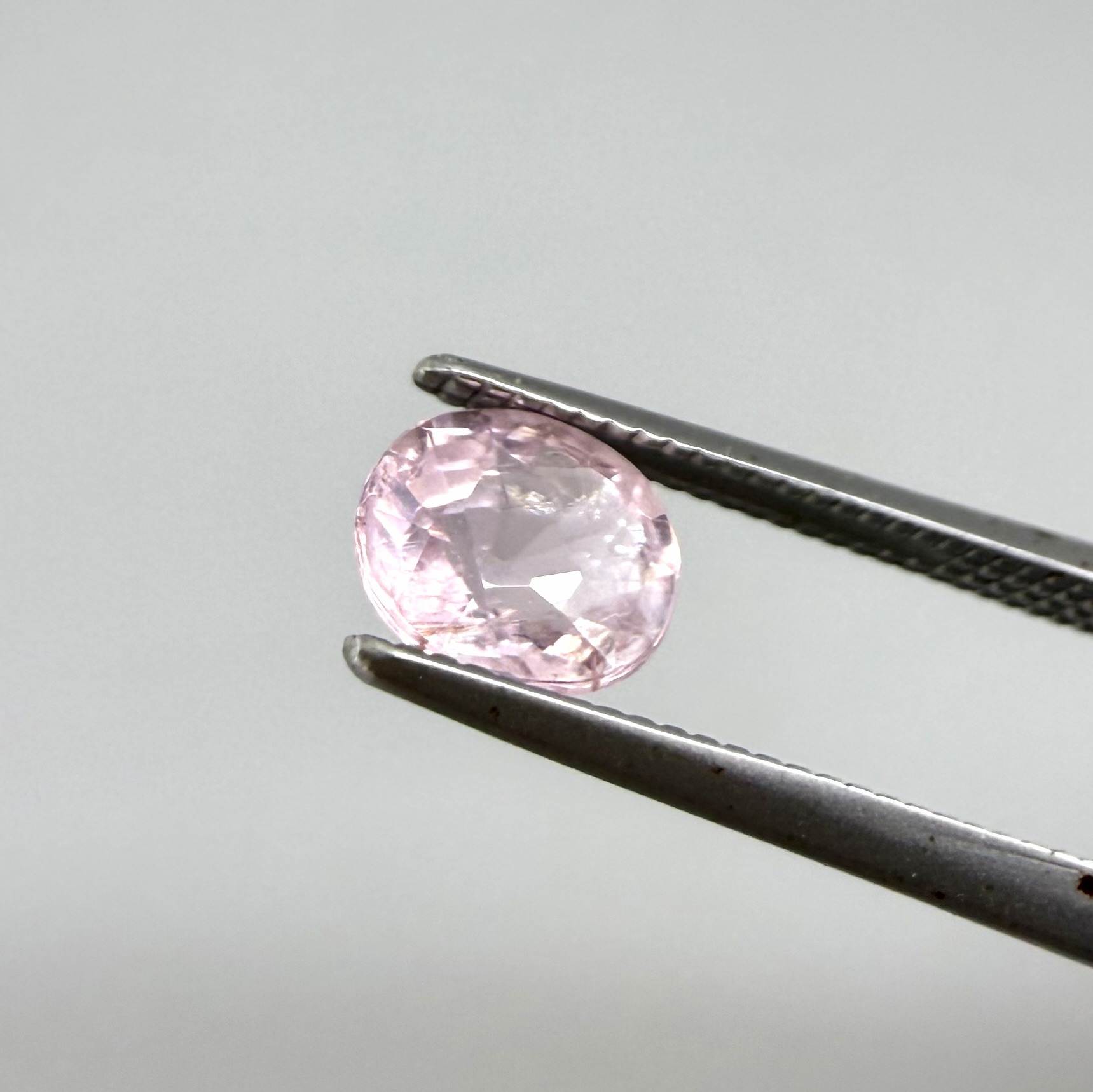 Natural untreated pink tourmaline, 0.75 ct oval cut from Nigeria with soft pink colour, eye-clean clarity and excellent brilliance.