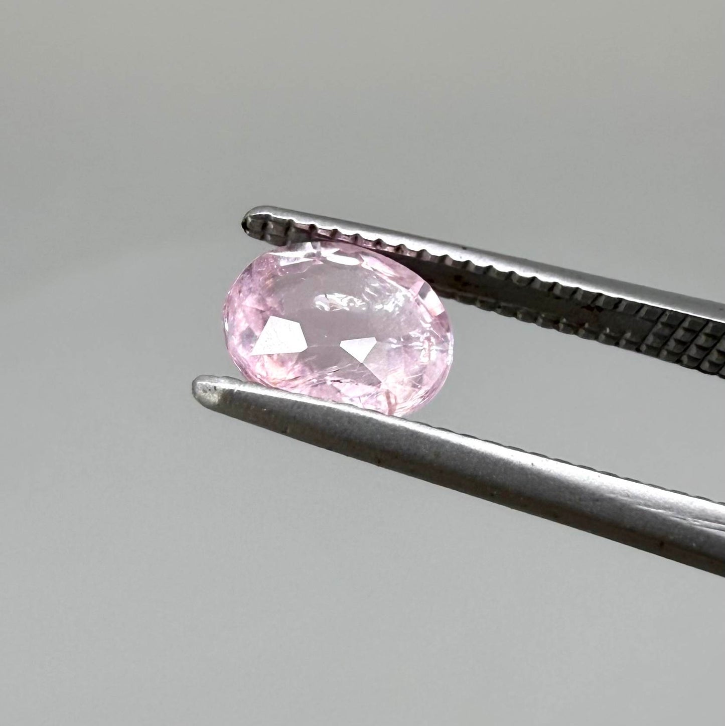 Natural untreated pink tourmaline, 0.75 ct oval cut from Nigeria with soft pink colour, eye-clean clarity and excellent brilliance.