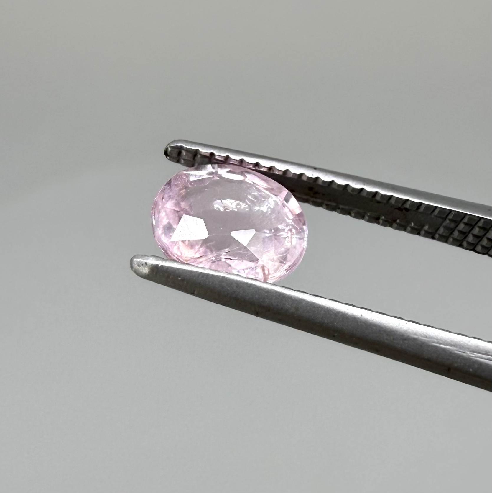 Natural untreated pink tourmaline, 0.75 ct oval cut from Nigeria with soft pink colour, eye-clean clarity and excellent brilliance.