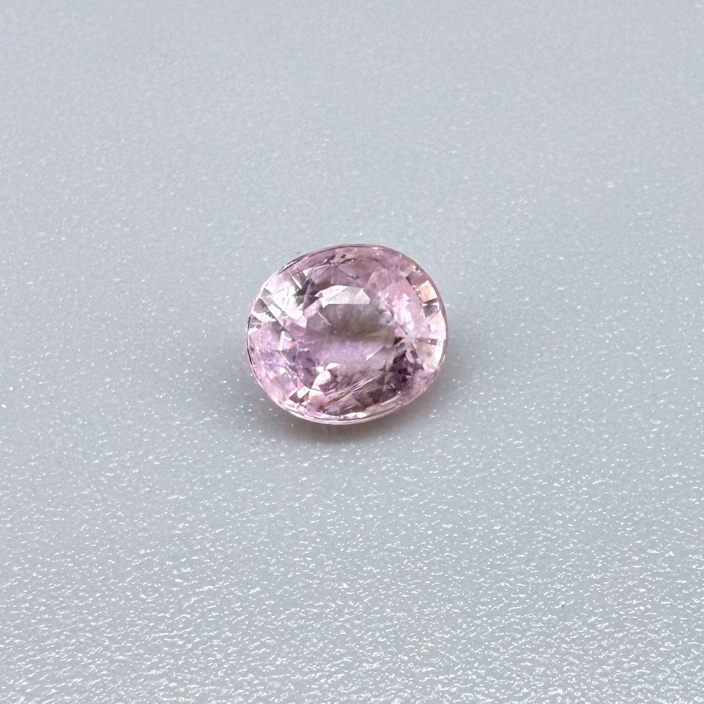Natural untreated pink tourmaline, 0.75 ct oval cut from Nigeria with soft pink colour, eye-clean clarity and excellent brilliance.