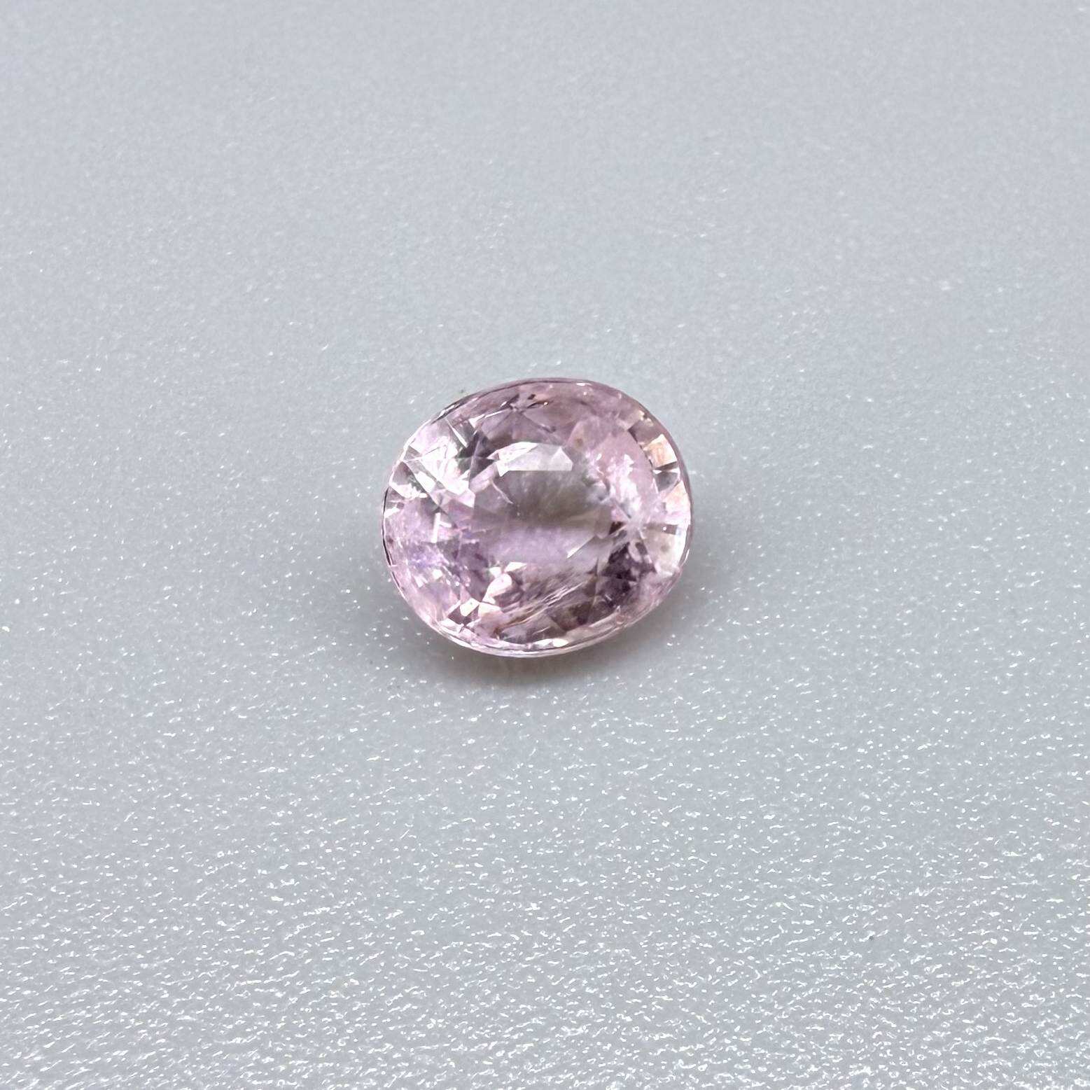 Natural untreated pink tourmaline, 0.75 ct oval cut from Nigeria with soft pink colour, eye-clean clarity and excellent brilliance.