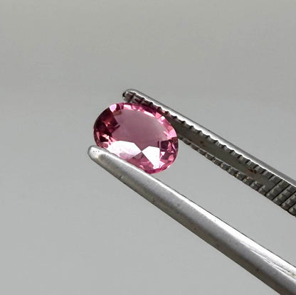 Natural untreated vivid raspberry pink tourmaline, 0.56 ct round cut from Nigeria with vivid raspberry pink colour, eye-clean clarity and exceptional brilliance.
