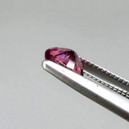 Natural untreated vivid raspberry pink tourmaline, 0.56 ct round cut from Nigeria with vivid raspberry pink colour, eye-clean clarity and exceptional brilliance.