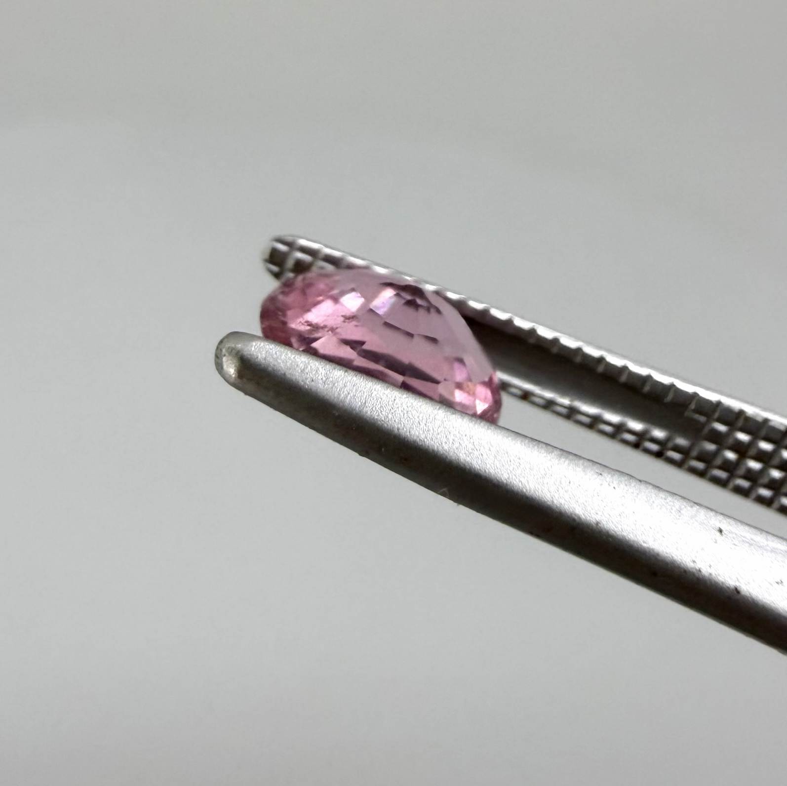 Natural untreated pink tourmaline, 0.61 ct oval cut from Nigeria with soft pink colour, lively brilliance and slight natural inclusions.