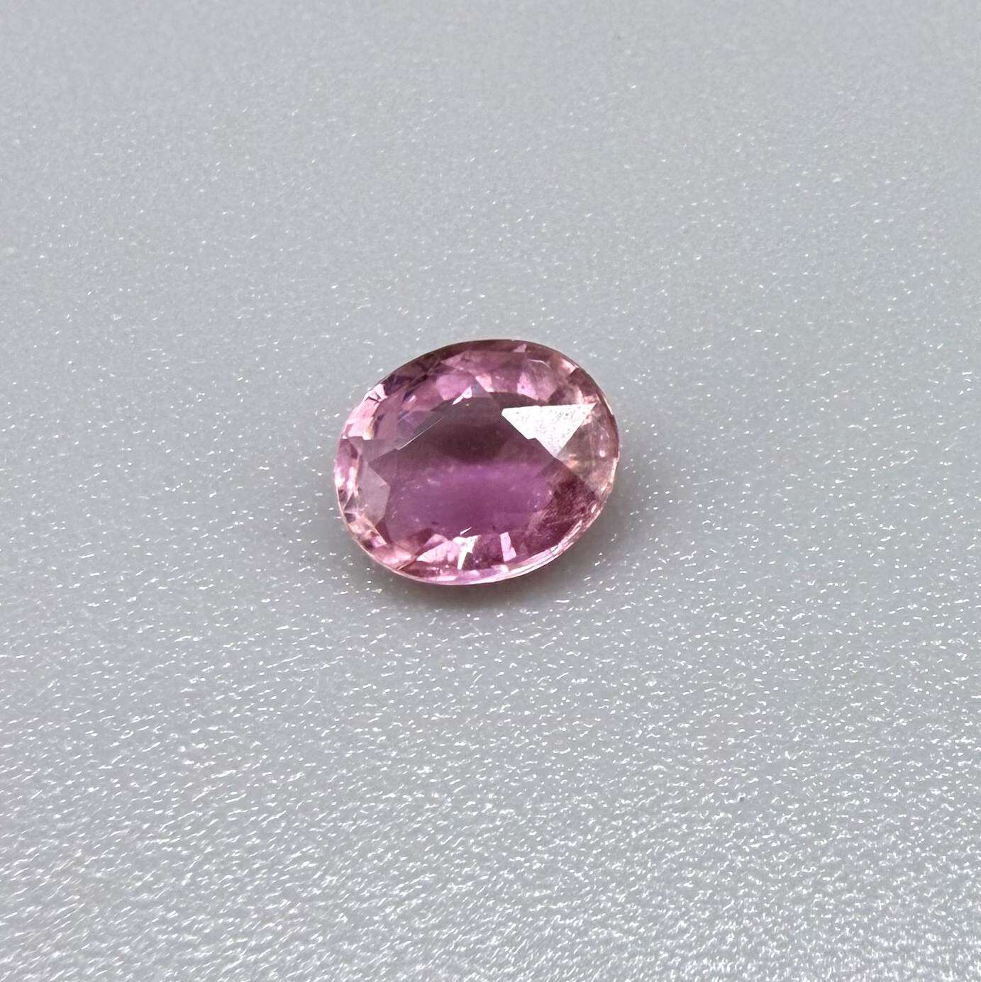 Natural untreated pink tourmaline, 0.61 ct oval cut from Nigeria with soft pink colour, lively brilliance and slight natural inclusions.