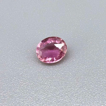 Natural untreated pink tourmaline, 0.61 ct oval cut from Nigeria with soft pink colour, lively brilliance and slight natural inclusions.