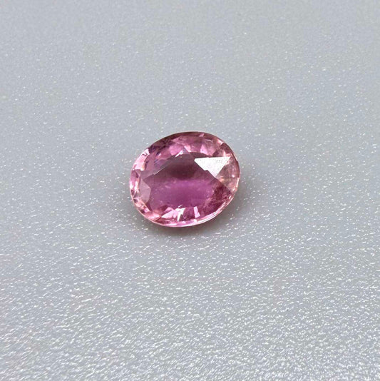 Natural untreated pink tourmaline, 0.61 ct oval cut from Nigeria with soft pink colour, lively brilliance and slight natural inclusions.