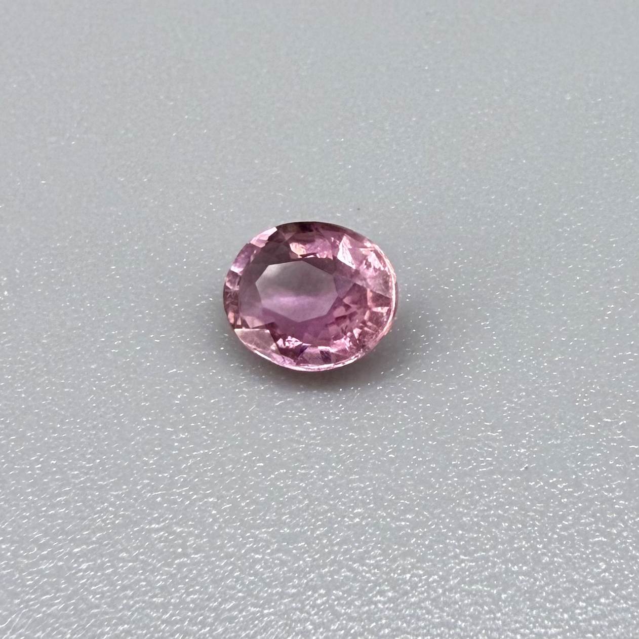 Natural untreated pink tourmaline, 0.61 ct oval cut from Nigeria with soft pink colour, lively brilliance and slight natural inclusions.