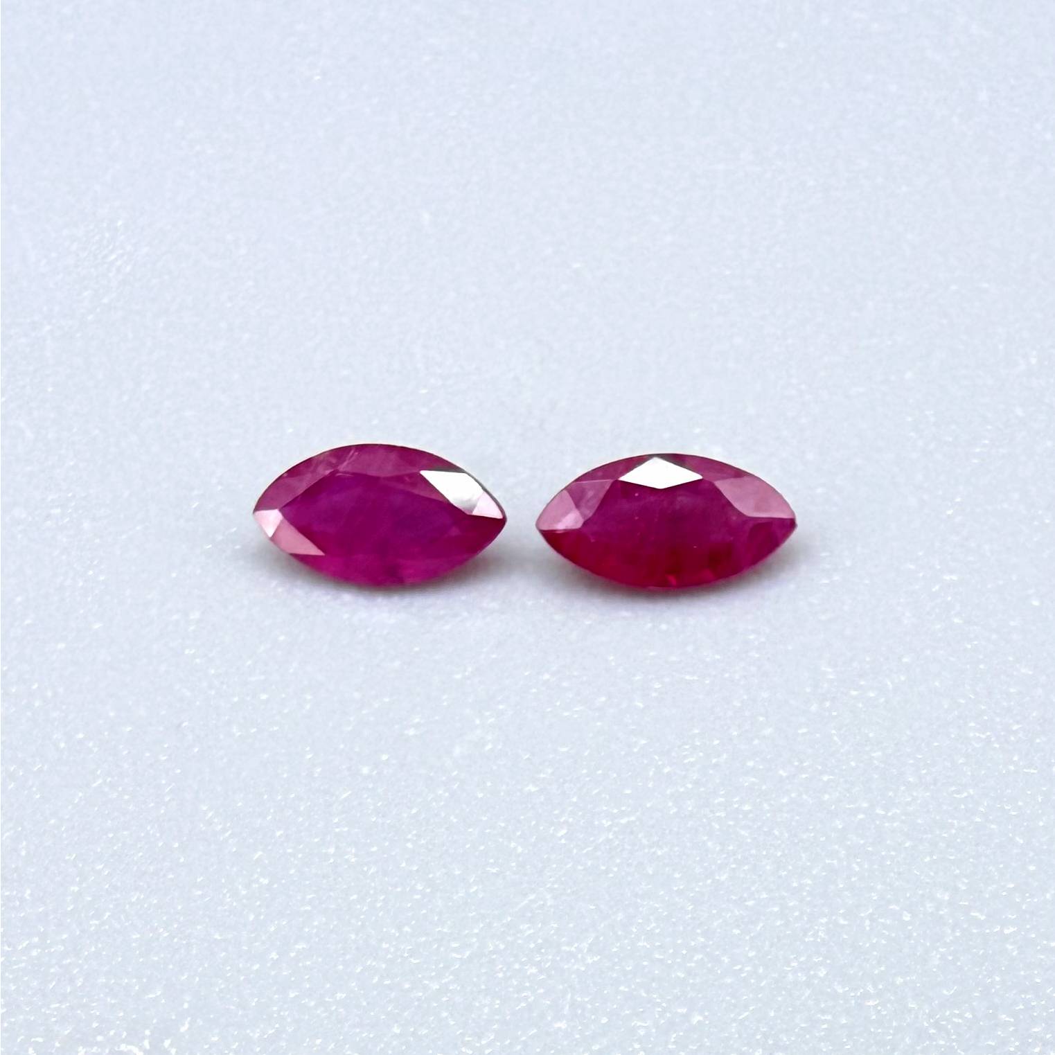 Faceted marquise-cut pink rubies with a total weight of 0.33 ct, eye-clean to slightly silky appearance with natural inclusions